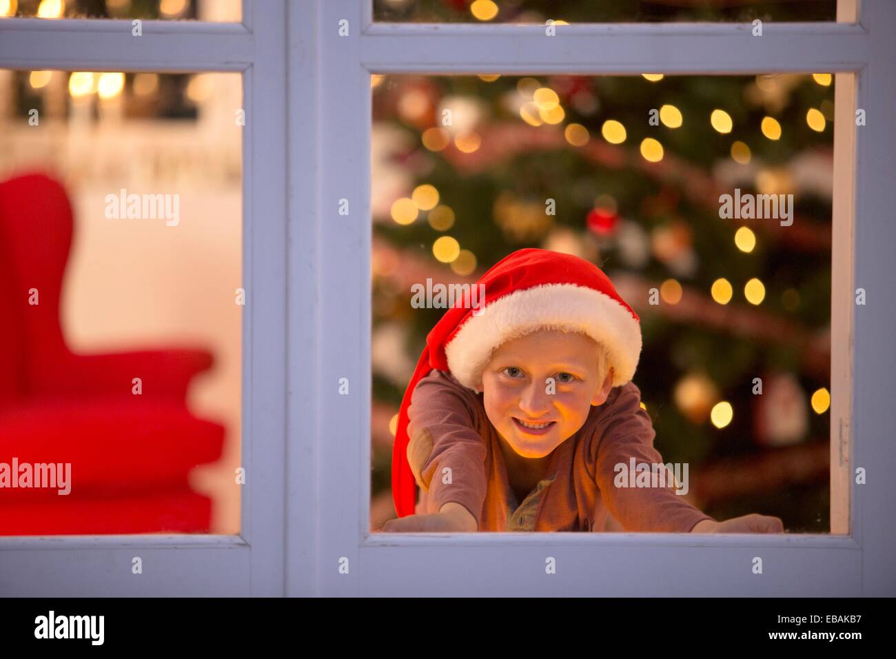 Young boy waiting for santa claus Stock Photo - Alamy