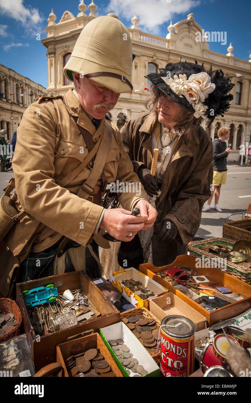 Kilted soldier and lady in Victorian dress browse for brass buttons, Victorian festival, historic precinct, Oamaru, Otago Stock Photo