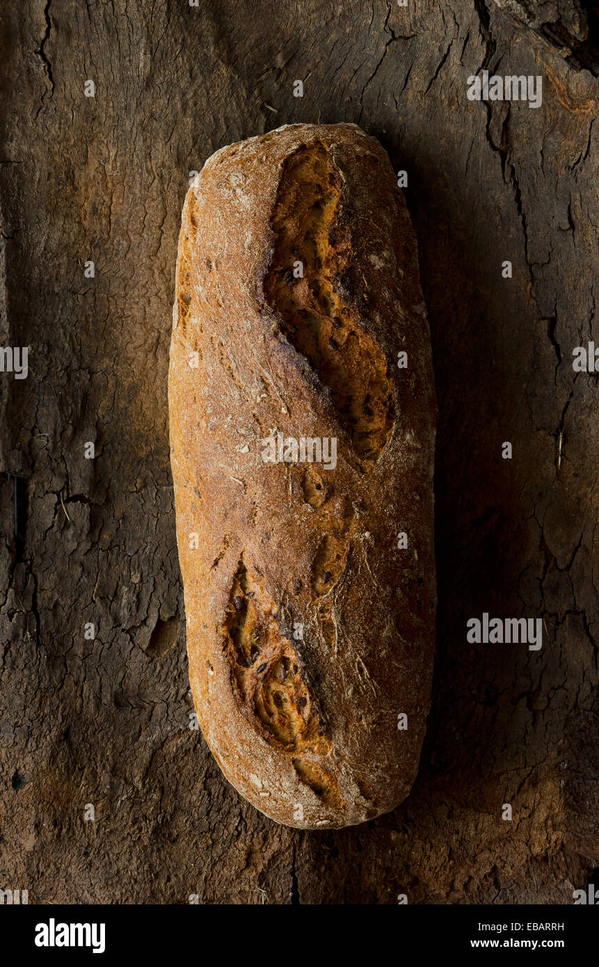 Traditional bread over tree bark, above view Stock Photo - Alamy