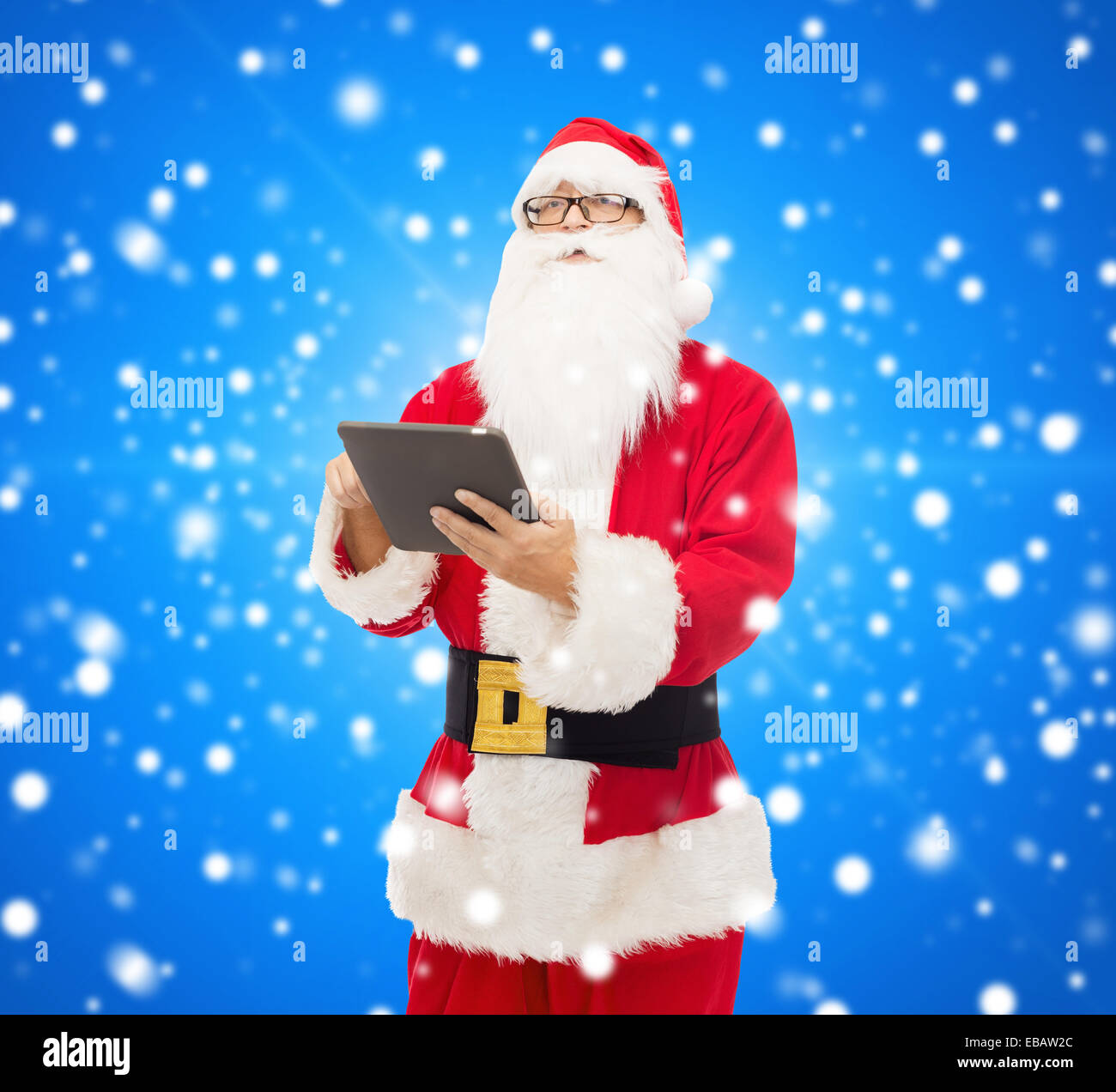 man in costume of santa claus with tablet pc Stock Photo - Alamy
