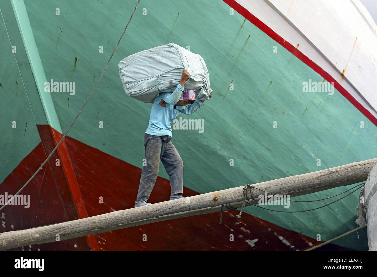 Carrying heavy load on his back