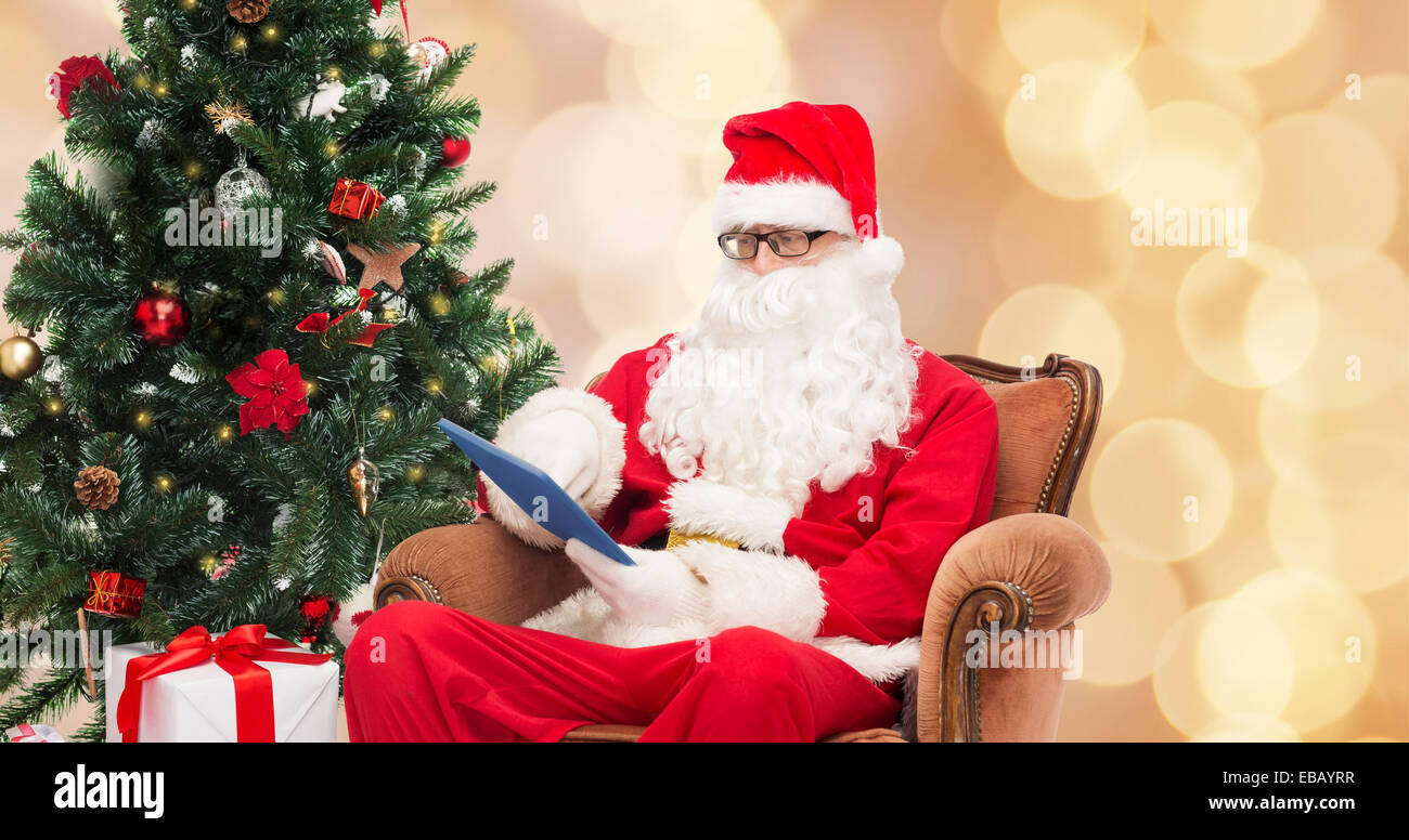 man in costume of santa claus with tablet pc Stock Photo - Alamy