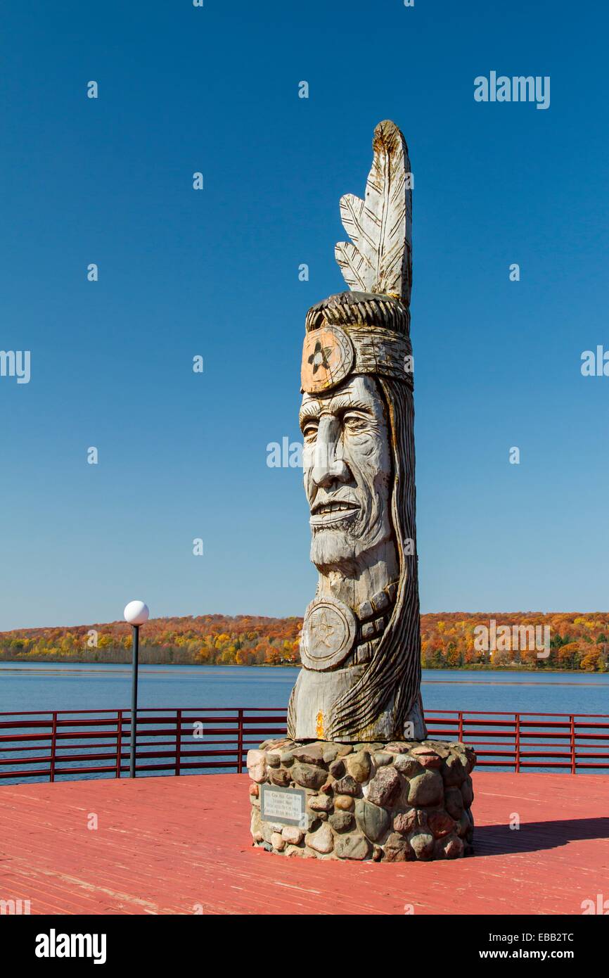 Wood craving of Indian totem pole at lakeside in Wakefield, Michigan, USA  Stock Photo - Alamy