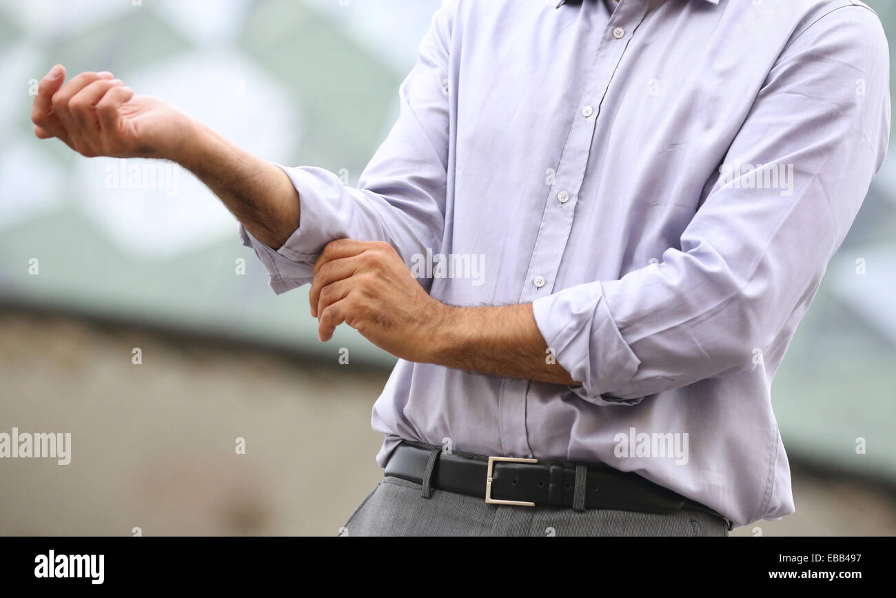 Businessman rolling sleeves up hires stock photography and images Alamy