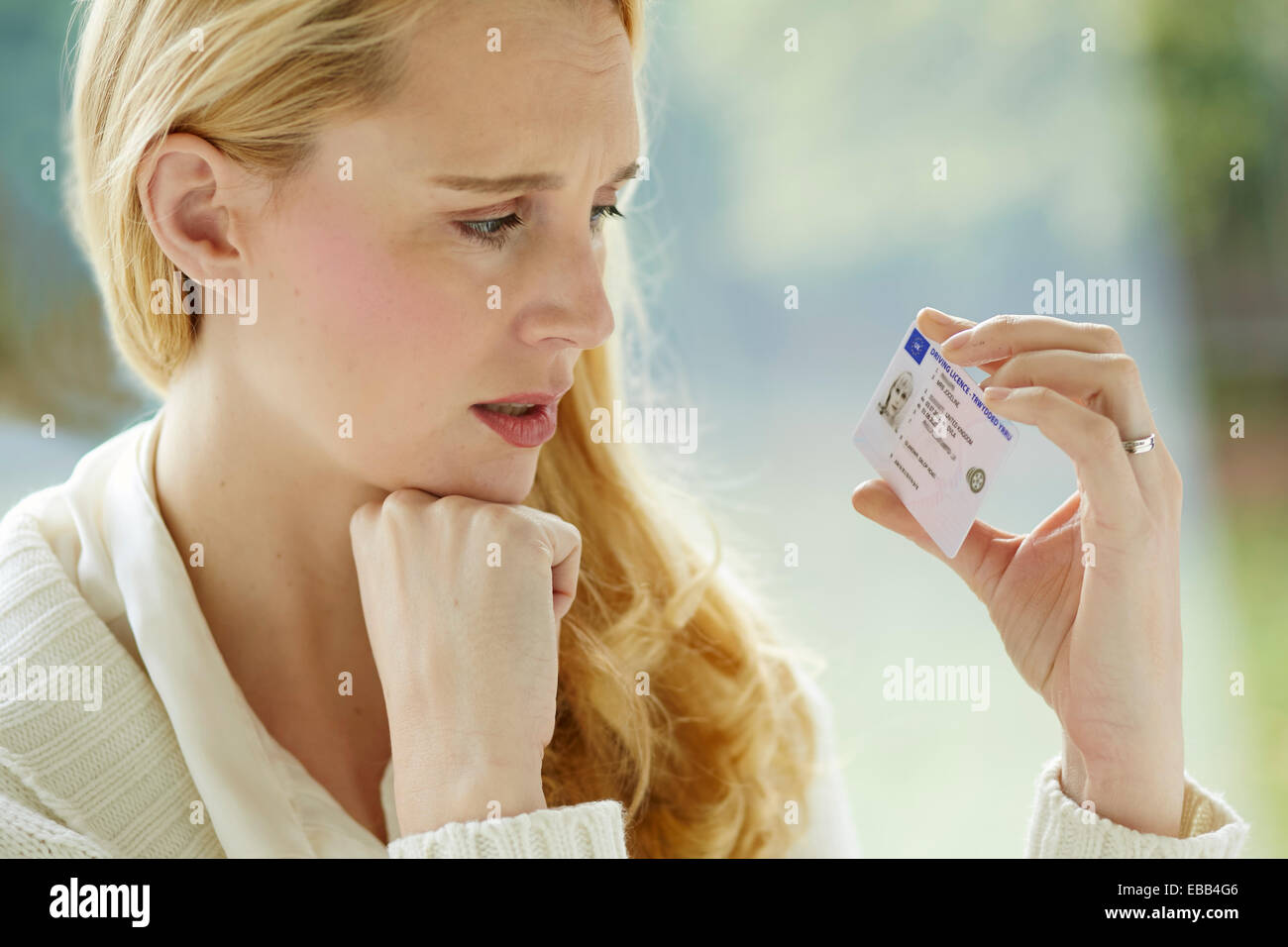 Woman holding driving license Stock Photo