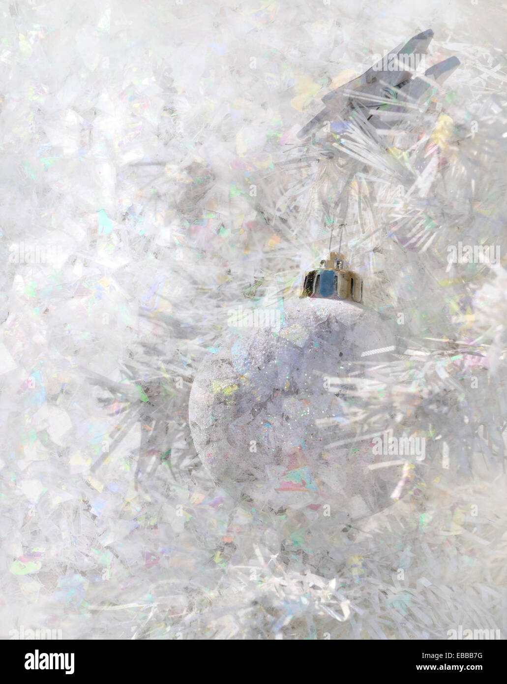 white Christmas ball and confetti superimposed Stock Photo