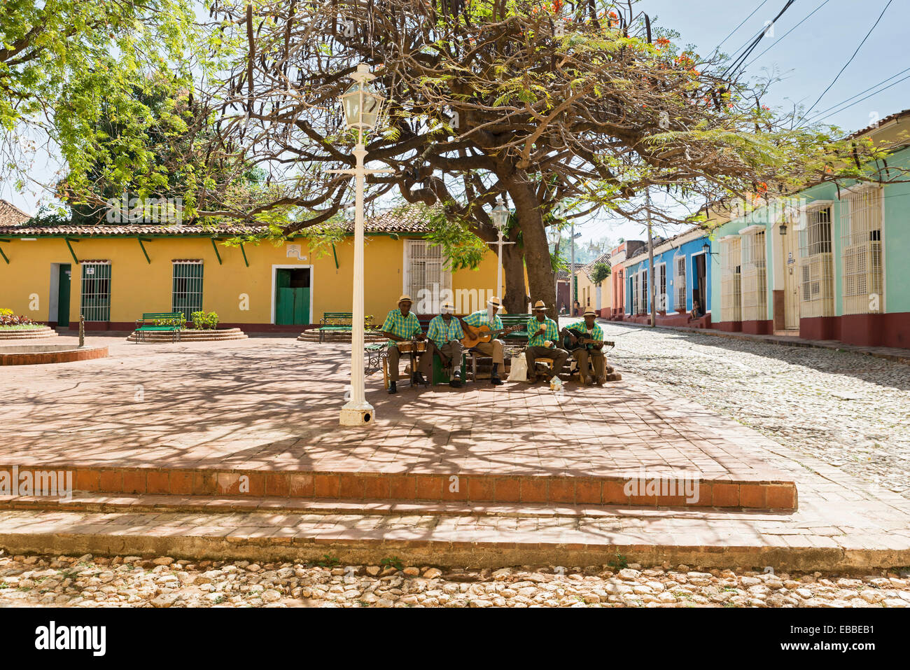 TRINIDAD, CUBA -MAY 8, 2014: Traditional musicians playing in the streets of Trinidad, declared by UNESCO World Heritage Site in Stock Photo
