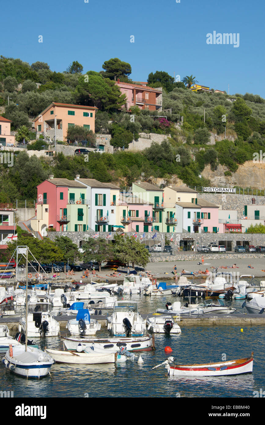 Moored boats and colourful seaside houses Porto Venere Liguria Italy Stock Photo