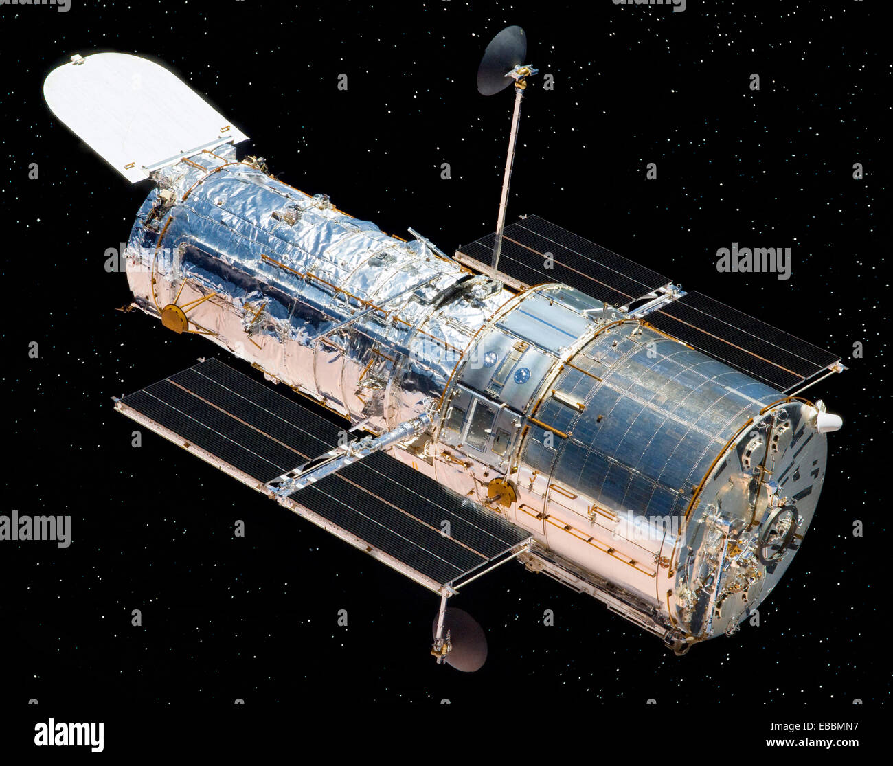 Hubble, released by the Space Shuttle Atlantis after Servicing Mission 4 in May 2009, floats against the background of space Stock Photo