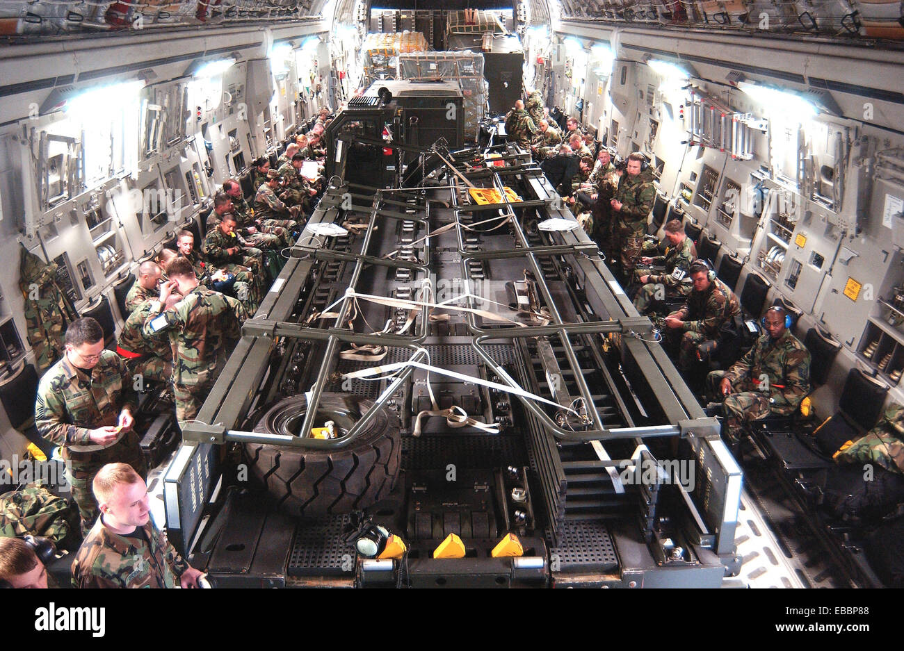 Airmen from McChord Air Force Base, Wash., sit on a C17 Globemaster