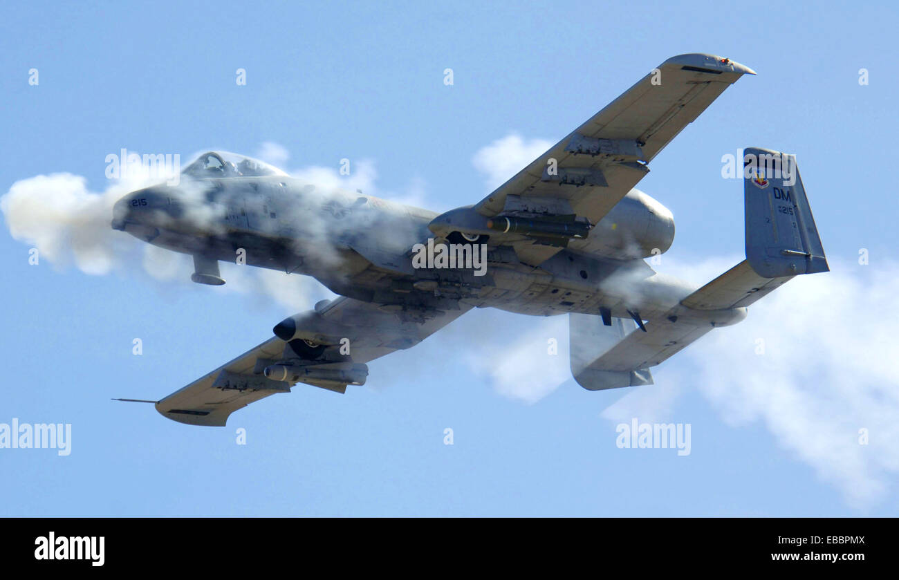 An A-10 Thunderbolt II fires its 30mm gun at a low-angle strafe as part of the 2006 Hawgsmoke competition, Thursday, March 23, Stock Photo