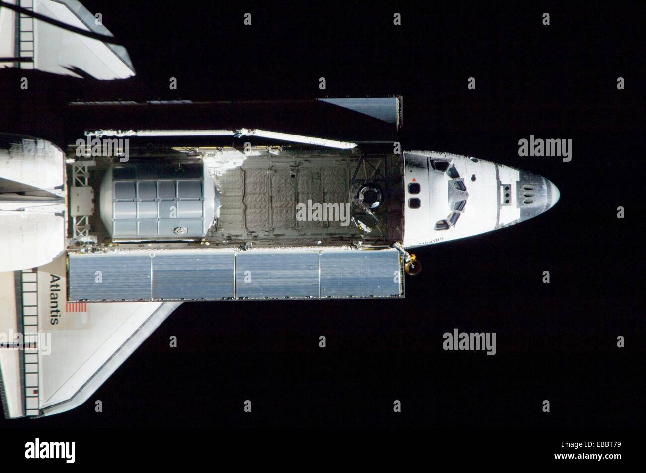 ISS028-E-015375 10 July 2011 --- A nadir view of the space shuttle Atlantis and its payload is provided by one of a series of Stock Photo