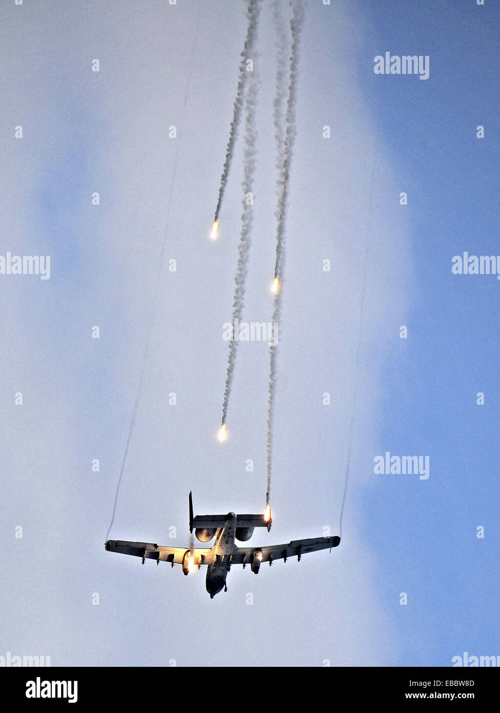 An A-10 Thunderbolt II fires flares as part of a combat search and rescue scenario Oct. 7 during Airpower Day at Osan Air Base, Stock Photo