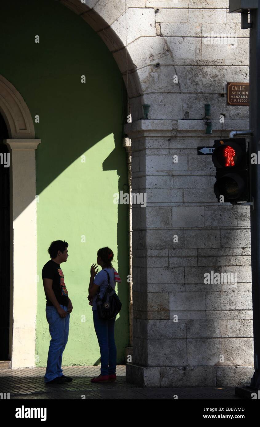 People in the archway of Palacio de Gobierno or Palace of Government Merida  Mexico. Stock Photo