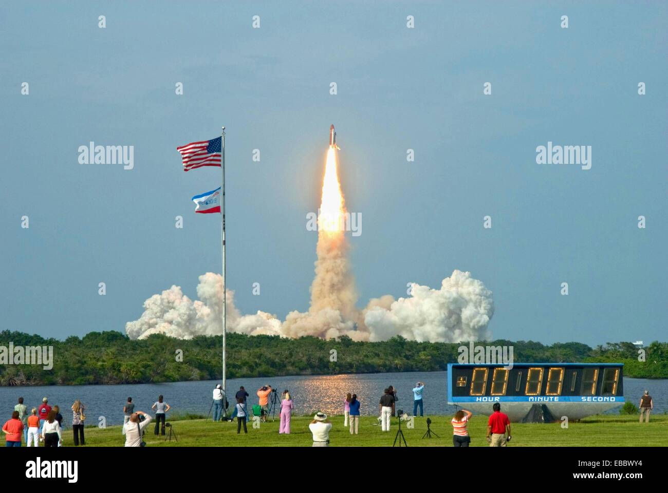 Endeavour Lifts Off  Under a cloud-washed sky, spectators watch as space shuttle Endeavour rises majestically from Launch Pad Stock Photo