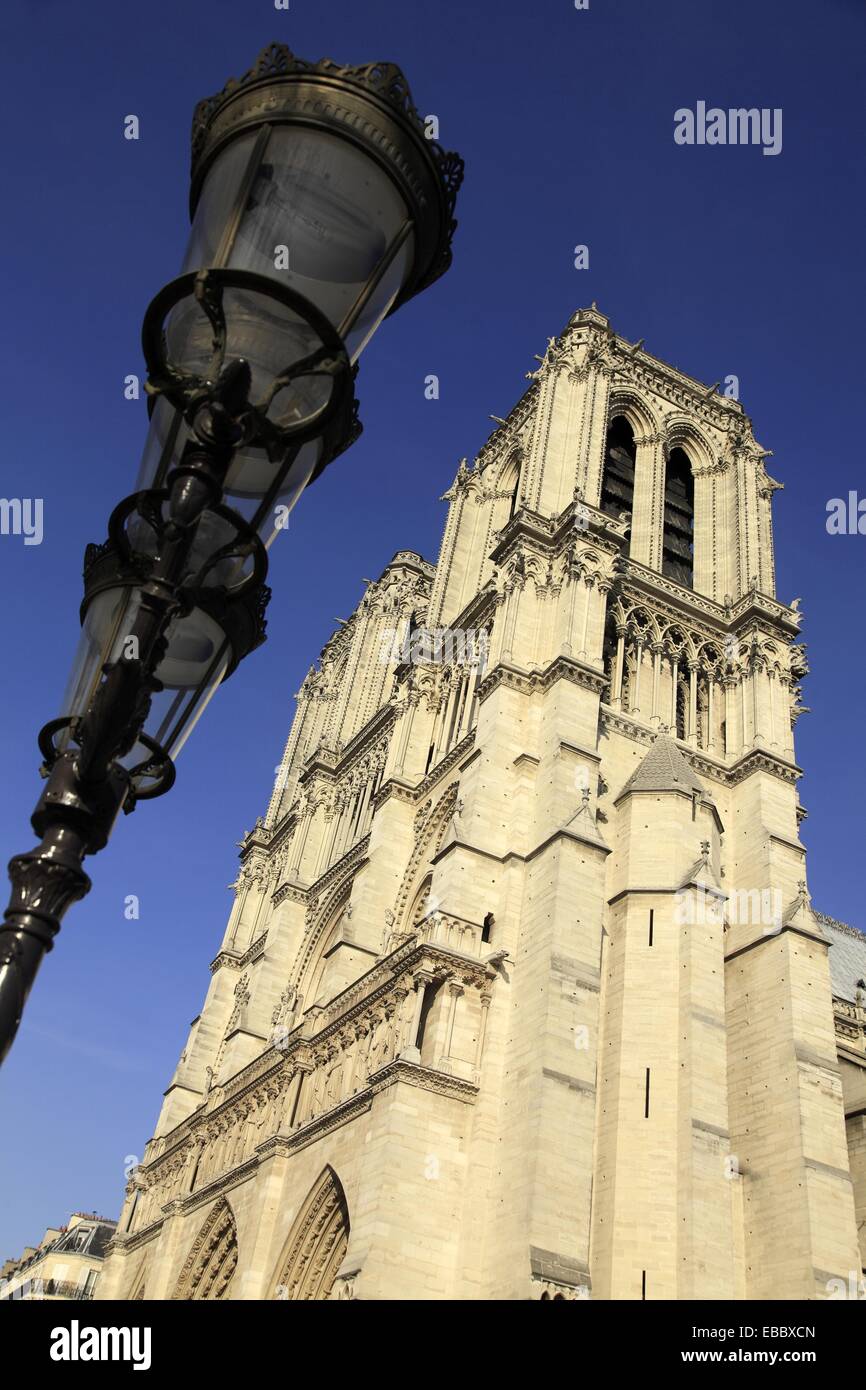 A lamp post with the bell towers of Notre Dame Cathedral  Paris  France. Stock Photo