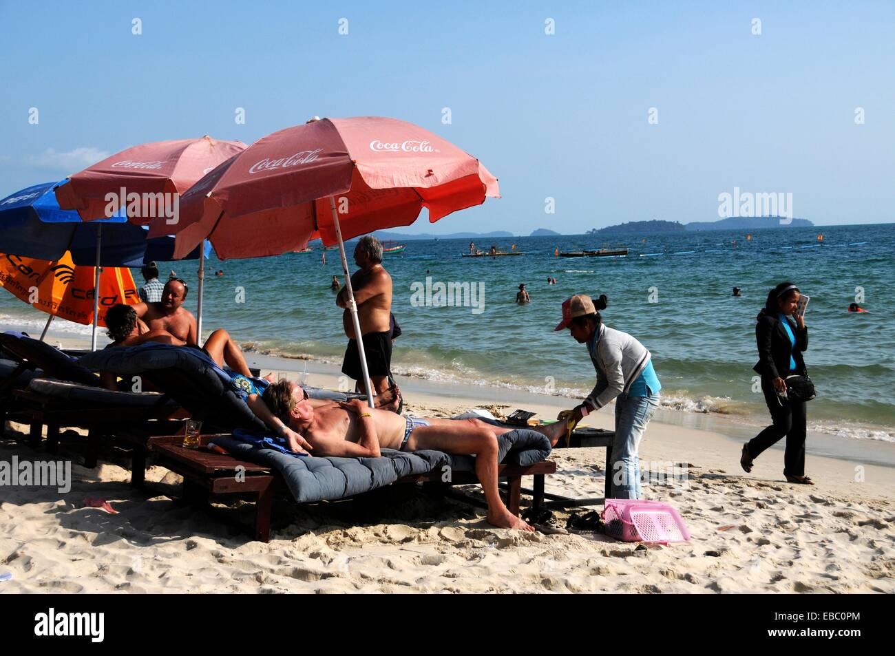 Foot massage on beach Stock Photo - Alamy
