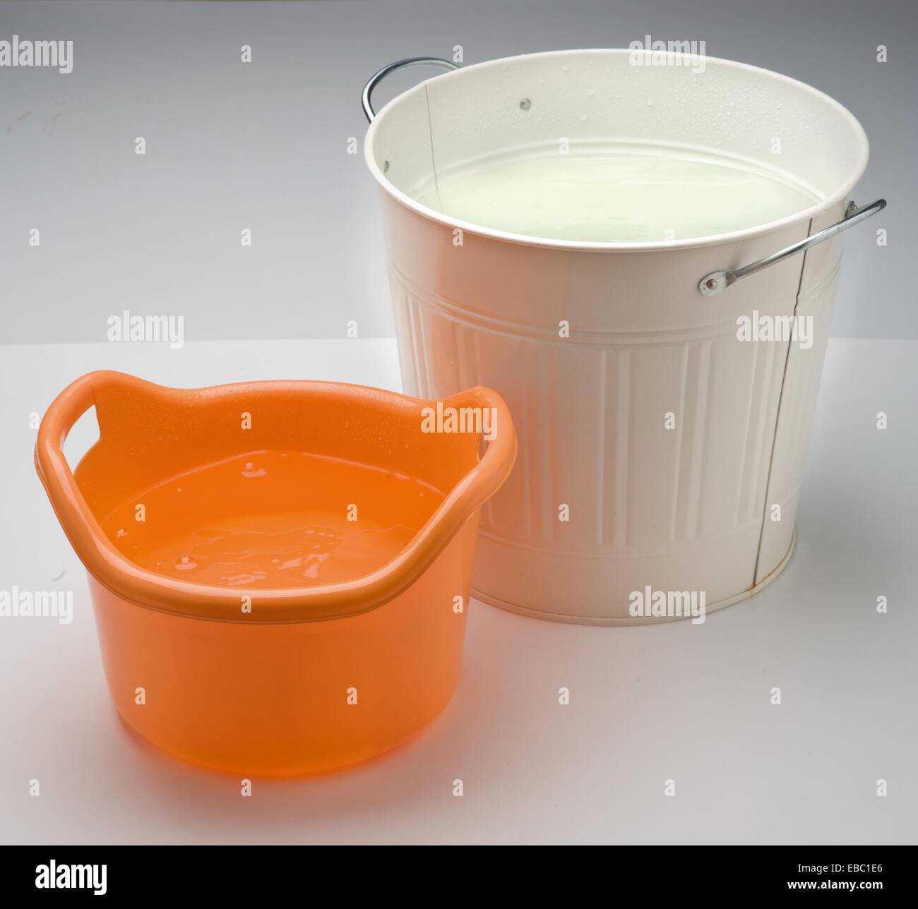 two buckets with water on white background Stock Photo Alamy