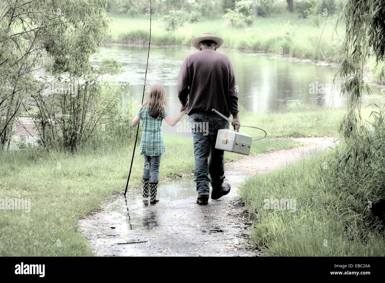 A grandfather and granddaughter fishing together Stock Photo