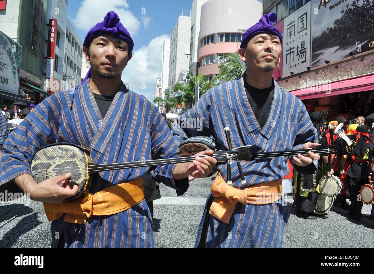 Naha, Okinawa, Japan, men in traditional Okinawan outfit, playing Stock ...