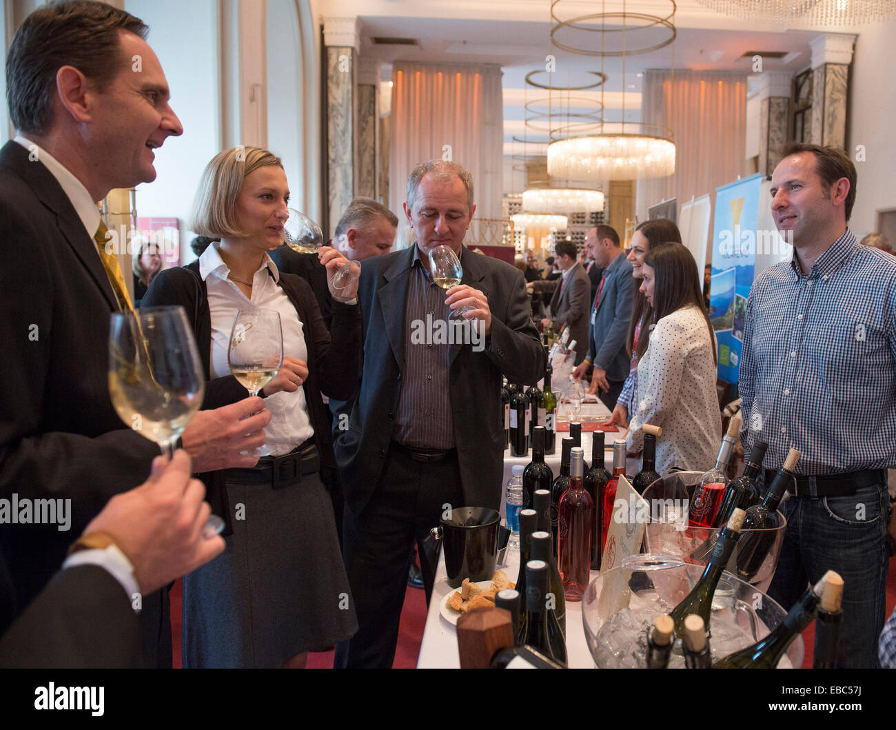 Zagreb, Croatia. 28th Nov, 2014. Visitors taste wine during the 9th Zagreb VINOcom-International Festival of Wine and Culinary Art at the Esplanade hotel in Zagreb, capital of Croatia, Nov. 28, 2014. The two-day wine and food festival kicked off here on Friday with participation of more than 300 wine and food exhibitors from Croatia and nearby region. © Miso Lisanin/Xinhua/Alamy Live News Stock Photo