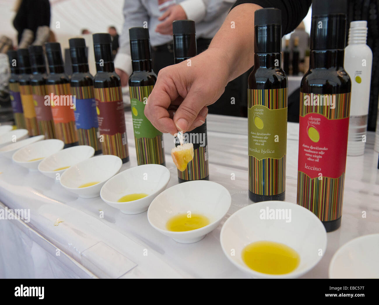 Zagreb, Croatia. 28th Nov, 2014. Visitors taste olive oil during the 9th Zagreb VINOcom-International Festival of Wine and Culinary Art at the Esplanade hotel in Zagreb, capital of Croatia, Nov. 28, 2014. The two-day wine and food festival kicked off here on Friday with participation of more than 300 wine and food exhibitors from Croatia and nearby region. © Miso Lisanin/Xinhua/Alamy Live News Stock Photo