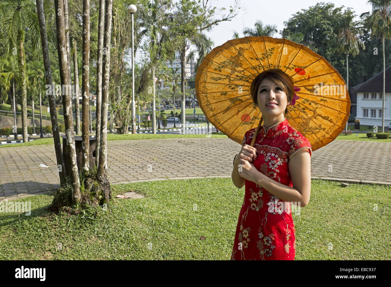 Chinese woman in traditional cheongsam outfit. Image taken at Sarawak
