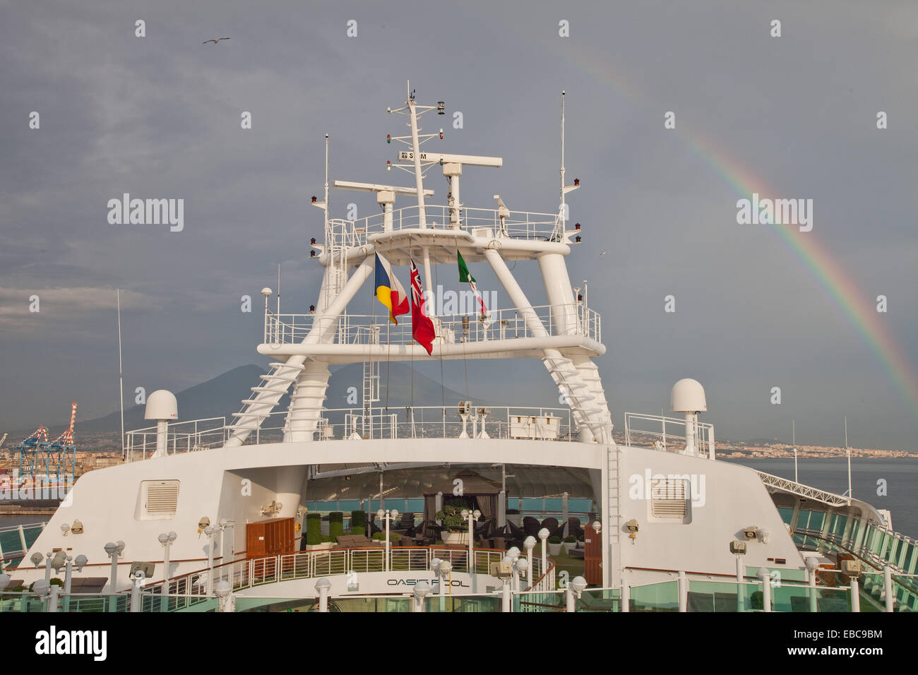 Flying the flags, leaving Naples(Napoli),and a rainbow can be seen through the haze rainbow,naples,heat haze, Stock Photo