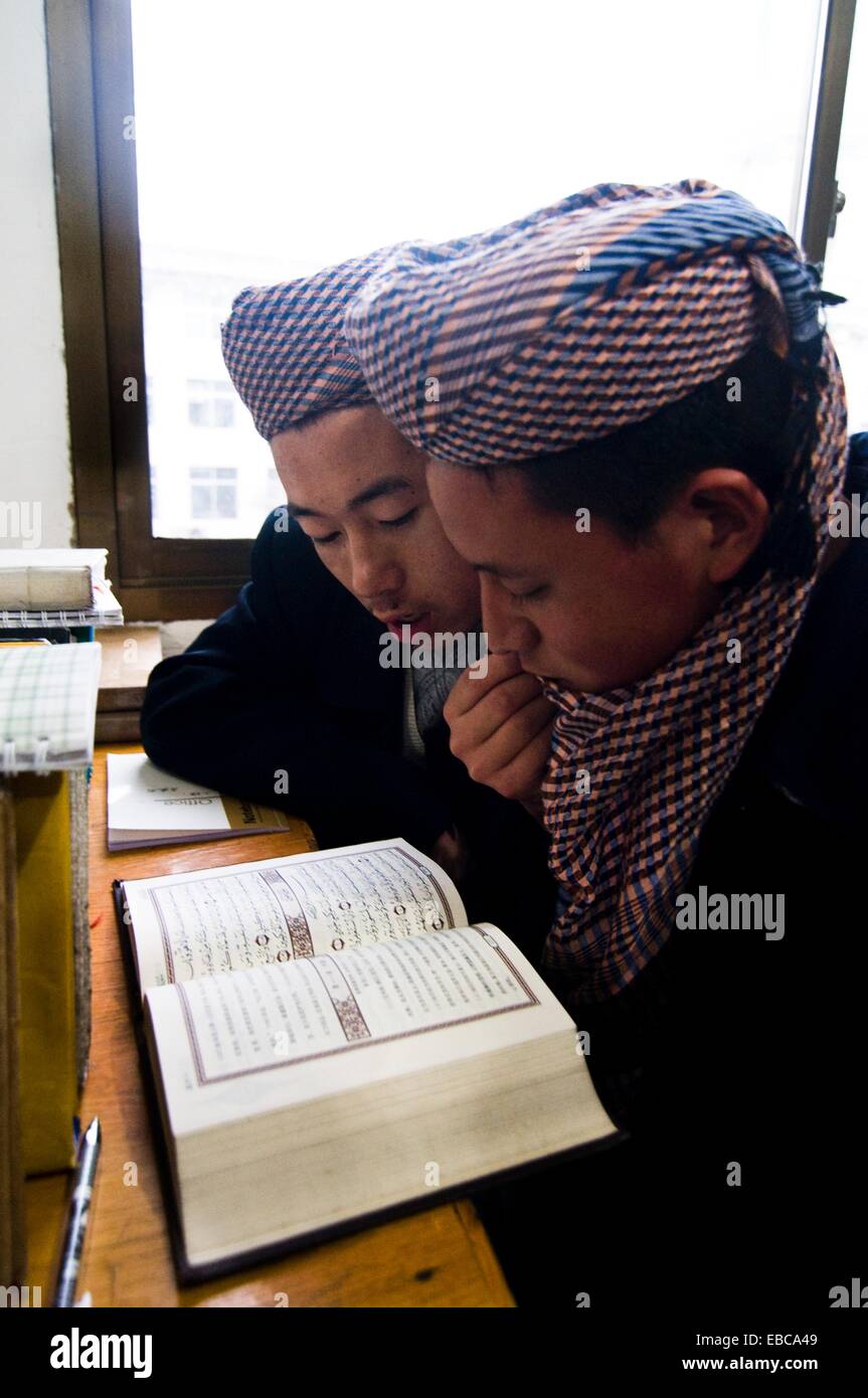 Hui Muslim boys studying the Qur´an in a Medressa in Gansu province Stock Photo