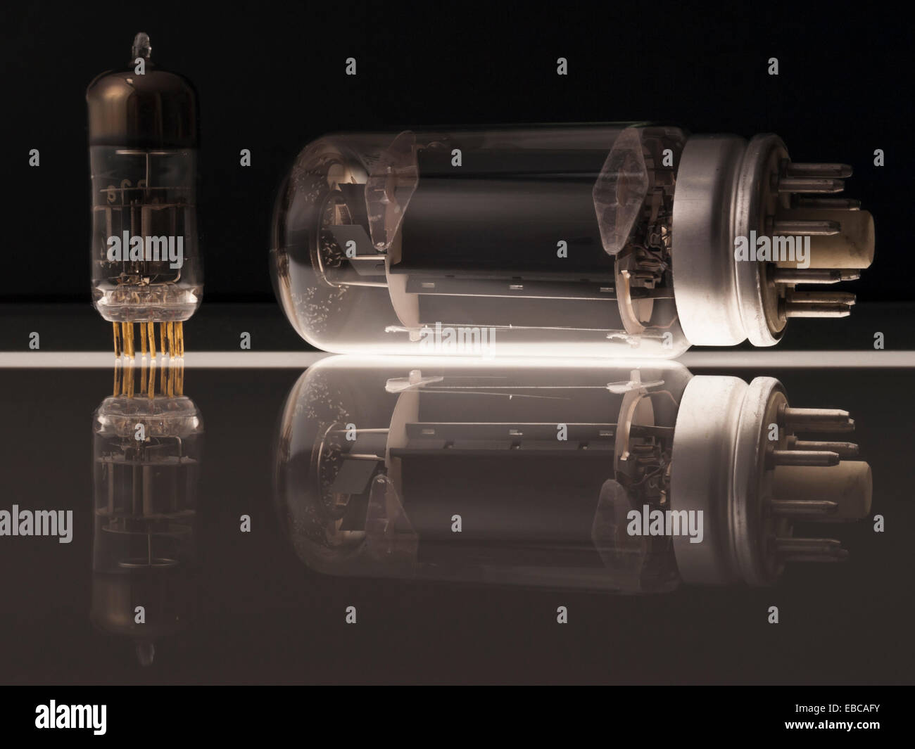 Reflection Tube Vacuum tubes on black background with reflection Stock Photo - Alamy