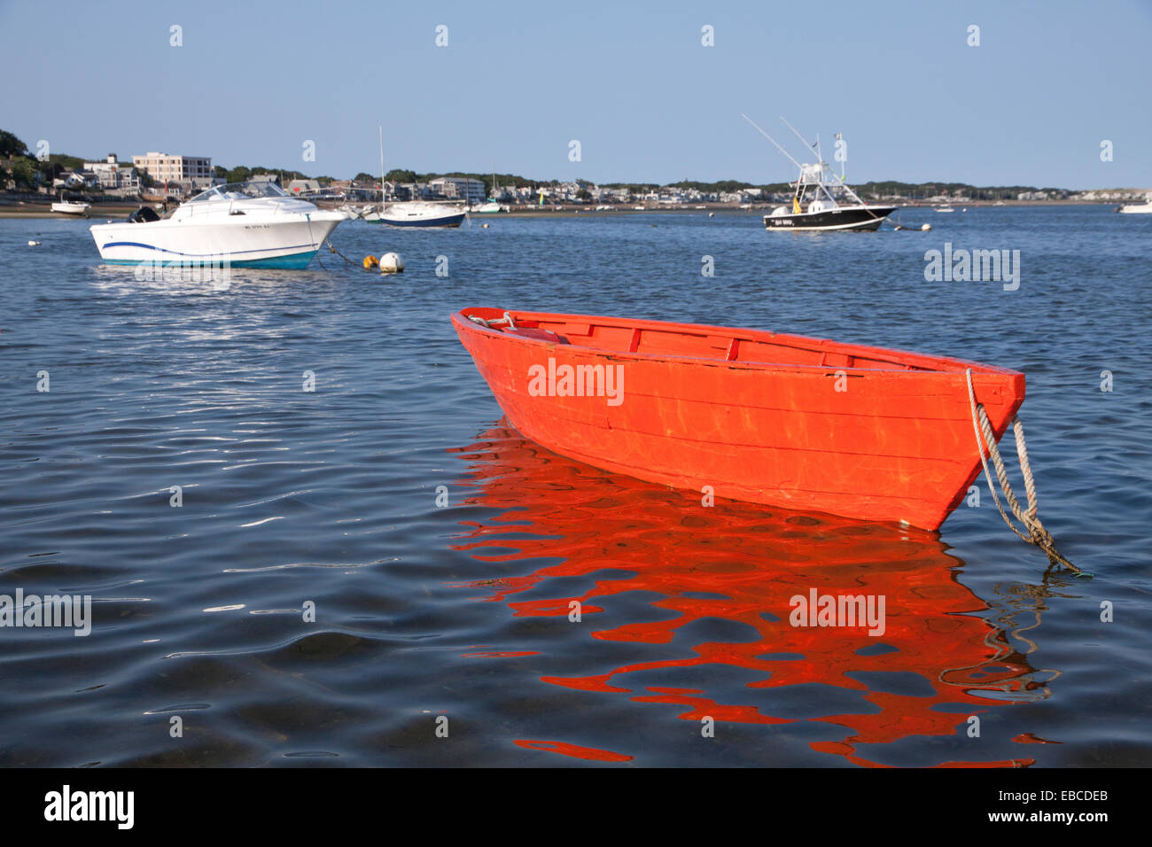 Glowing red dory in Cape Cod Bay in Massachusetts. Stock Photo