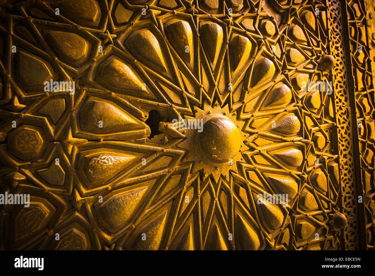 Arabesque ornament carving detail of the bronze gates at Sultan al-Mu ...