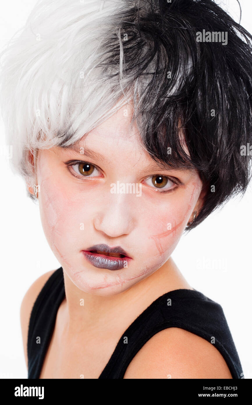 Portrait of a Young Girl in Wig and Scary Makeup Stock Photo