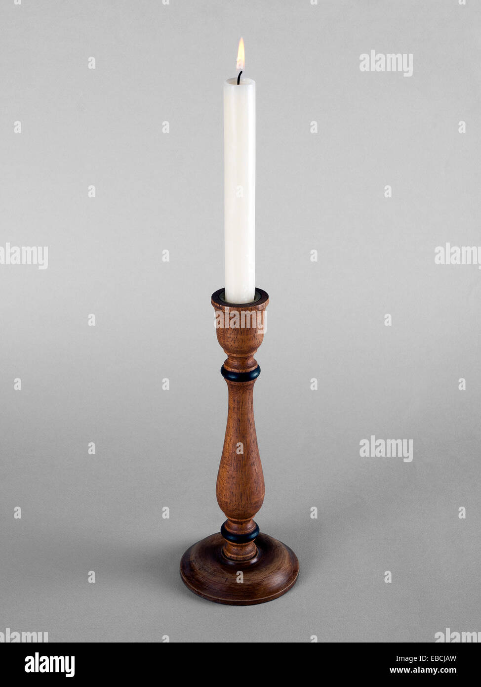 Wooden candlestick with white candle Stock Photo Alamy