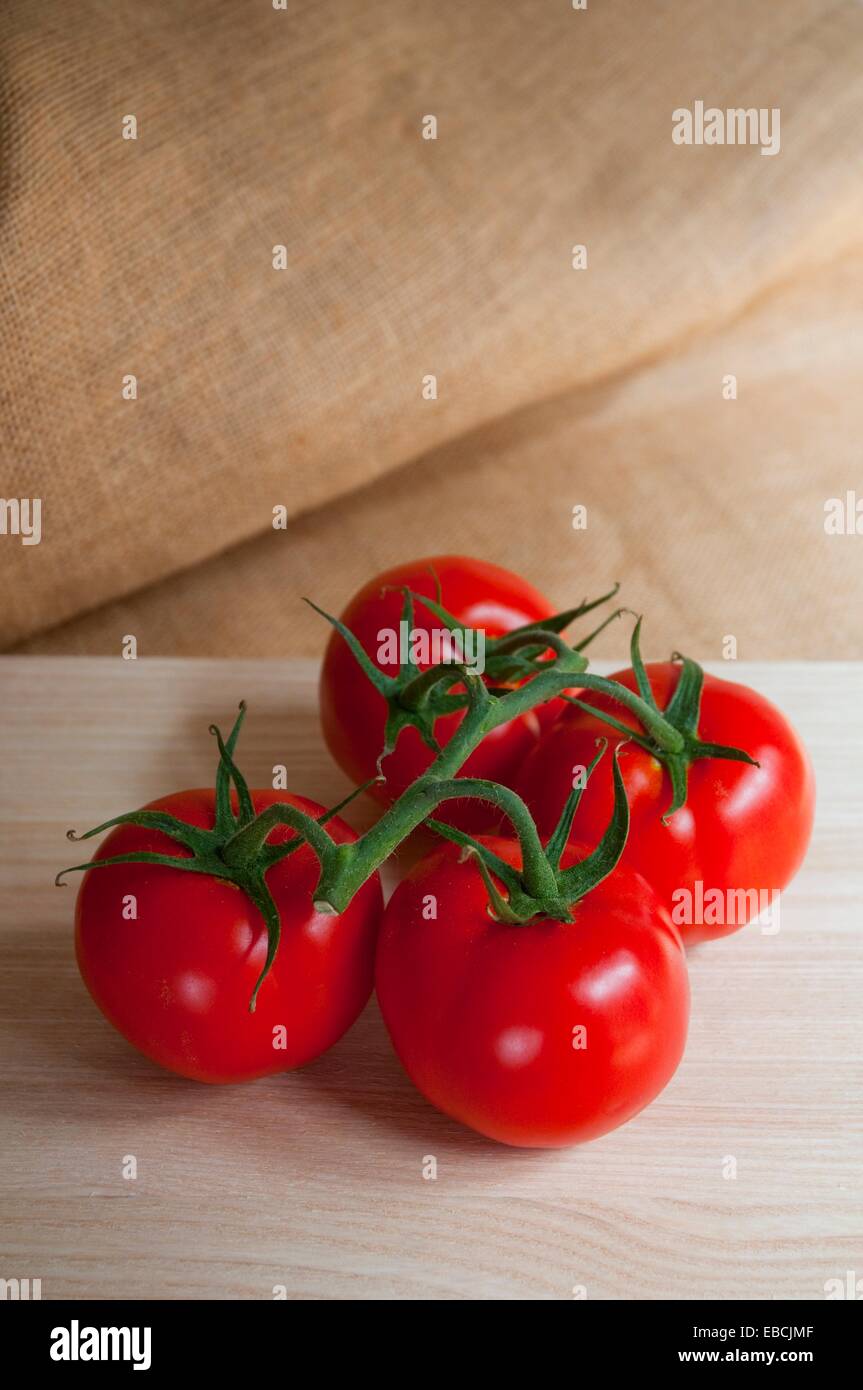 Bunch 4 tomatoes hi-res stock photography and images - Alamy