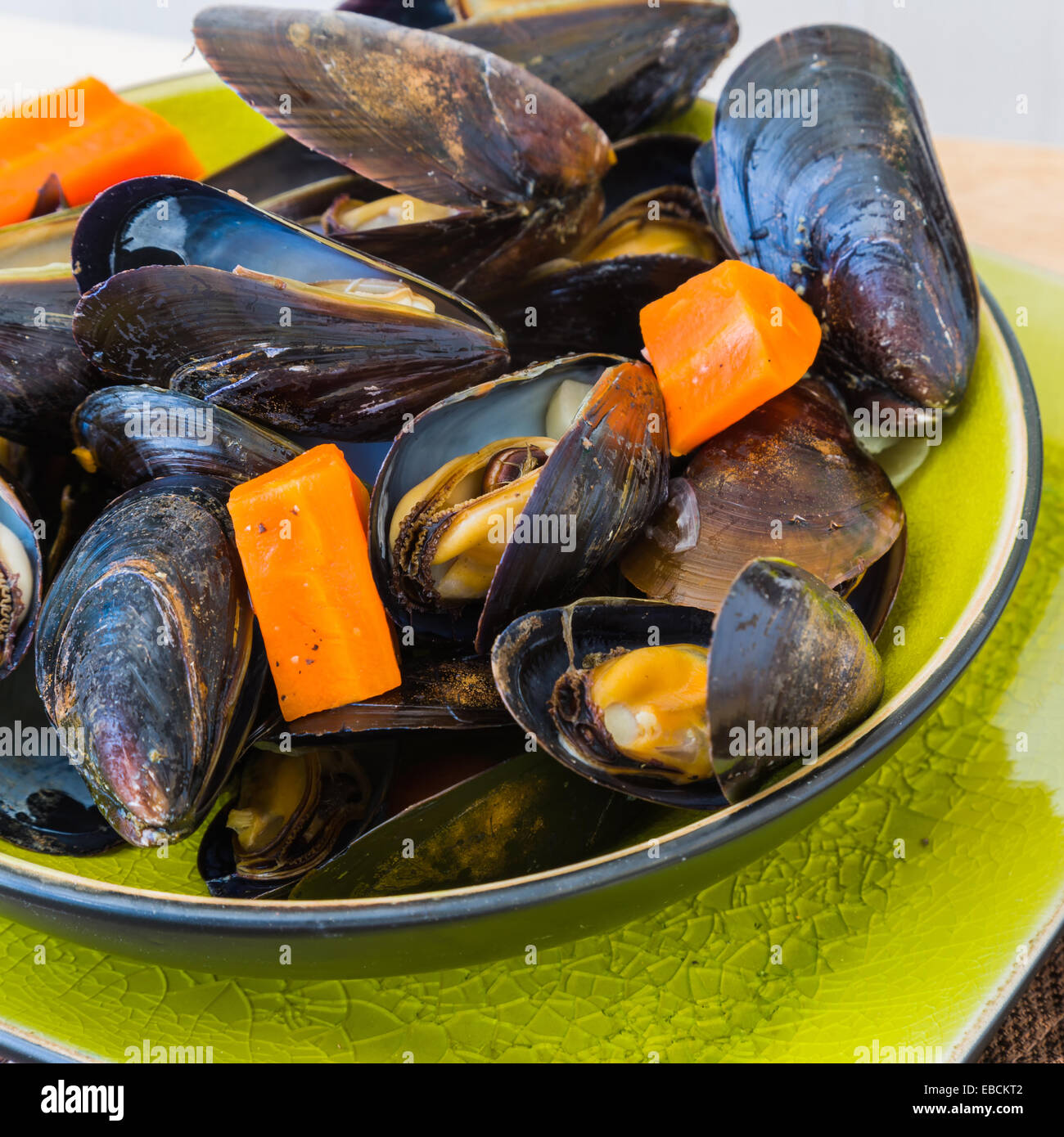 Mussels cooked with beer and vegetables such as carrots and onion Stock