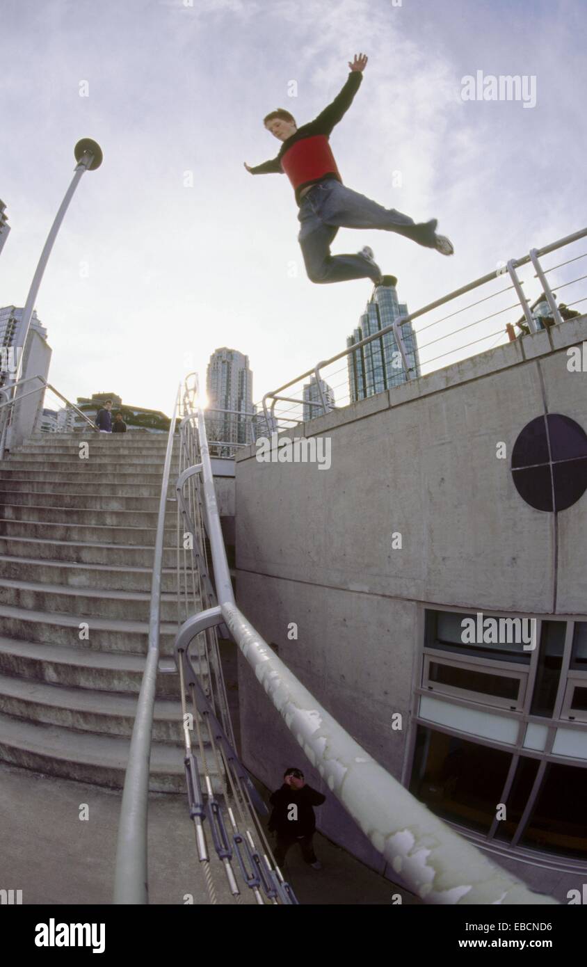 Young man jumping over railing hires stock photography and images Alamy