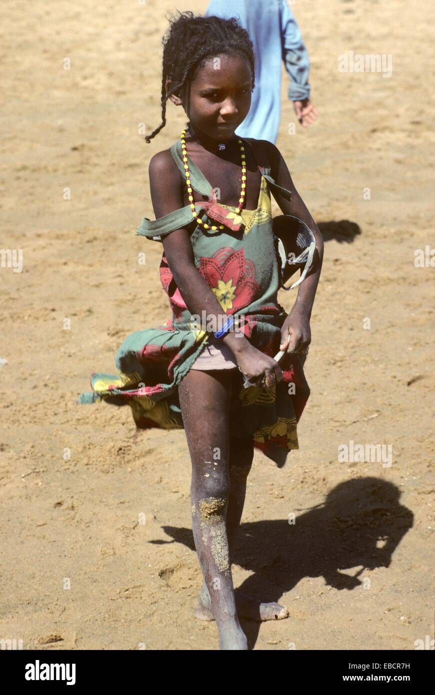 Little nomad girl, women at well in a street of N´djamena, Chad