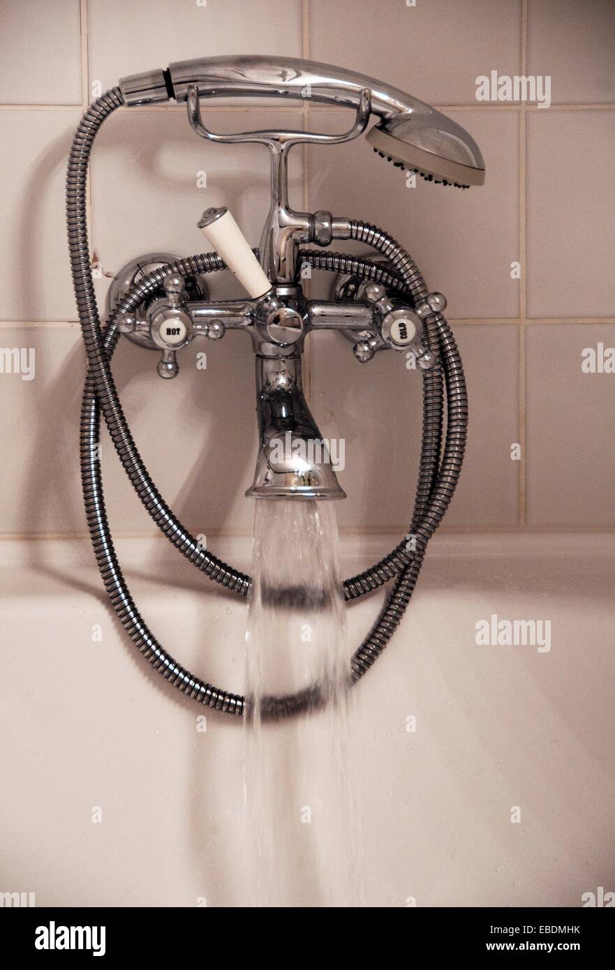 Bathroom Water Pouring To Bathtub From Old Fashioned Water Faucet Hand Shower Tiles In The Background Stock Photo Alamy