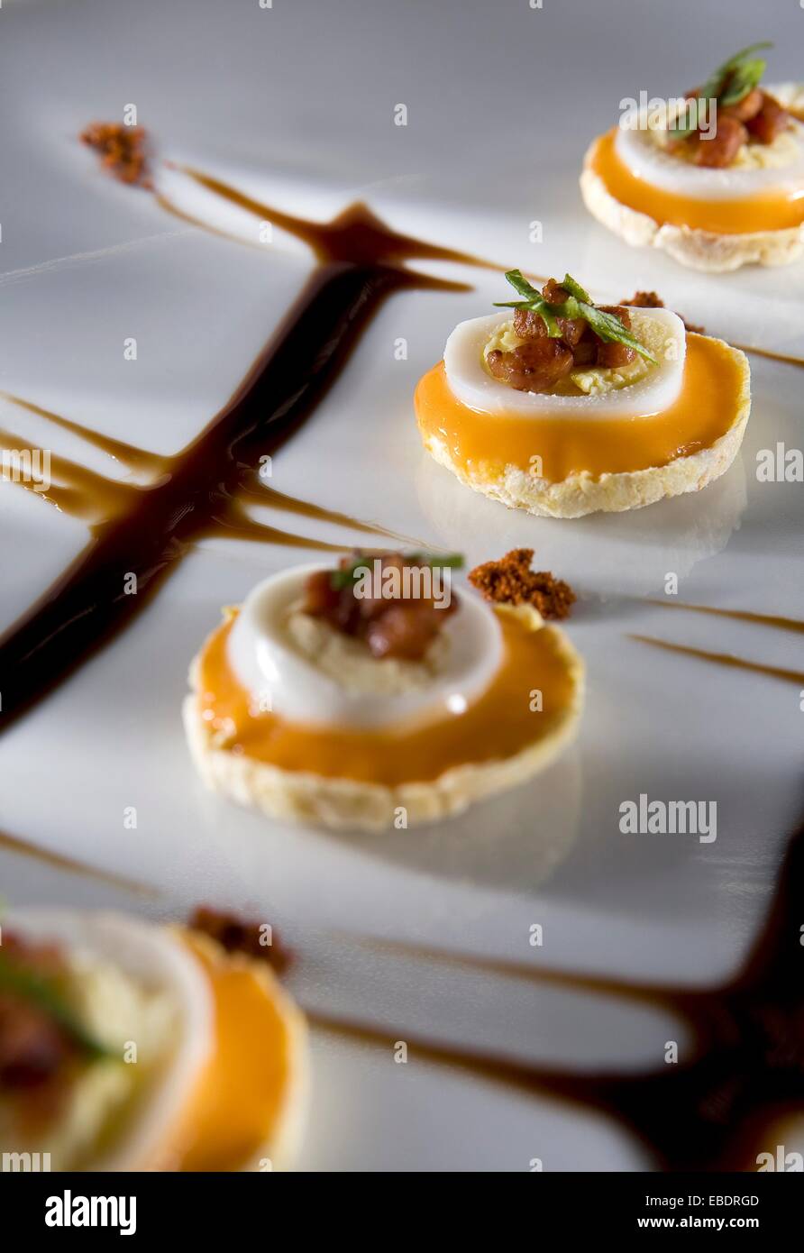 Catering recipe Quail Eggs, bacon and ´salmorejo´ on corn chips Stock Photo Alamy