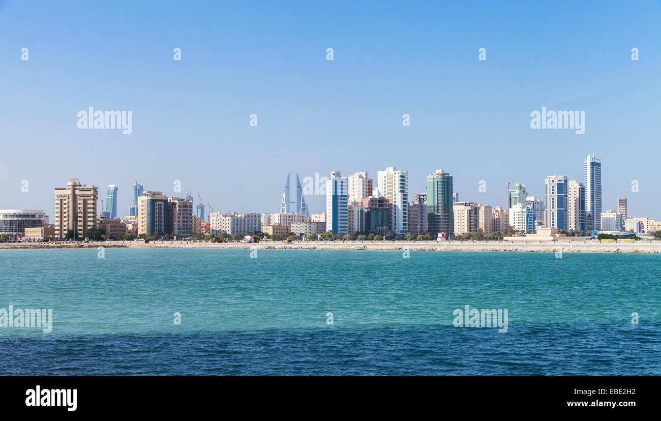 Modern tall buildings on the horizon. Skyline of Manama city, Bahrain Stock Photo