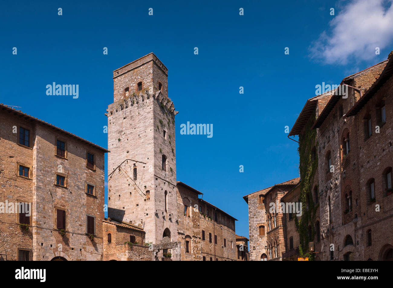 Tower and Buildings, Piazza della Cisterna, San Gimignano, Province of Siena, Tuscany, Italy Stock Photo