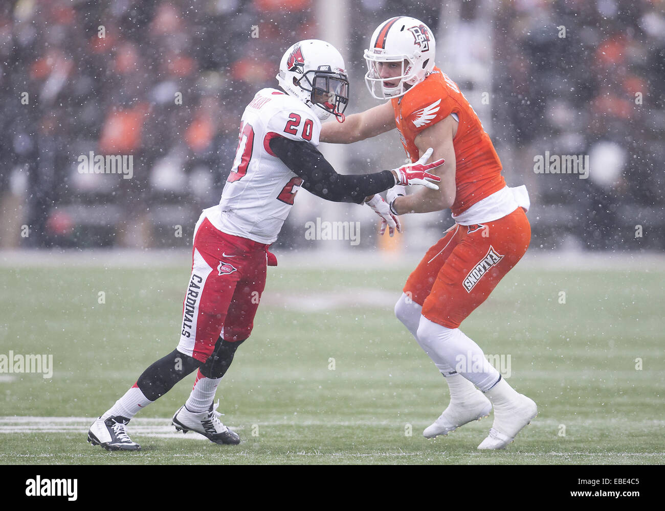 Bowling Green, Ohio, USA. 28th Nov, 2014. Bowling Green wide receiver Gehrig Dieter (4) and Ball State cornerback Darius Conaway (20) during NCAA Football game action between the Bowling Green Falcons and the Ball State Cardinals at Doyt L. Perry Stadium in Bowling Green, Ohio. Ball State defeated Bowling Green 41-24. © csm/Alamy Live News Stock Photo