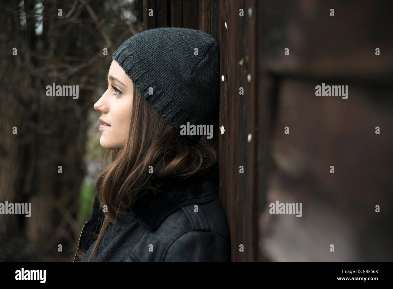 Portrait of teenage girl outdoors wearing hat, Germany Stock Photo