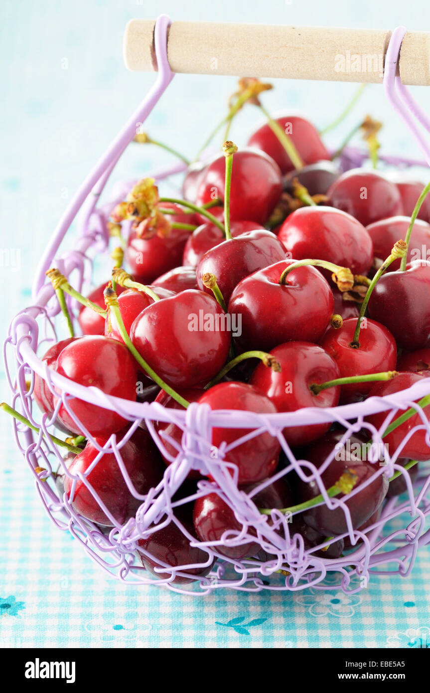 Close-up of Basket of Cherries, Studio Shot Stock Photo