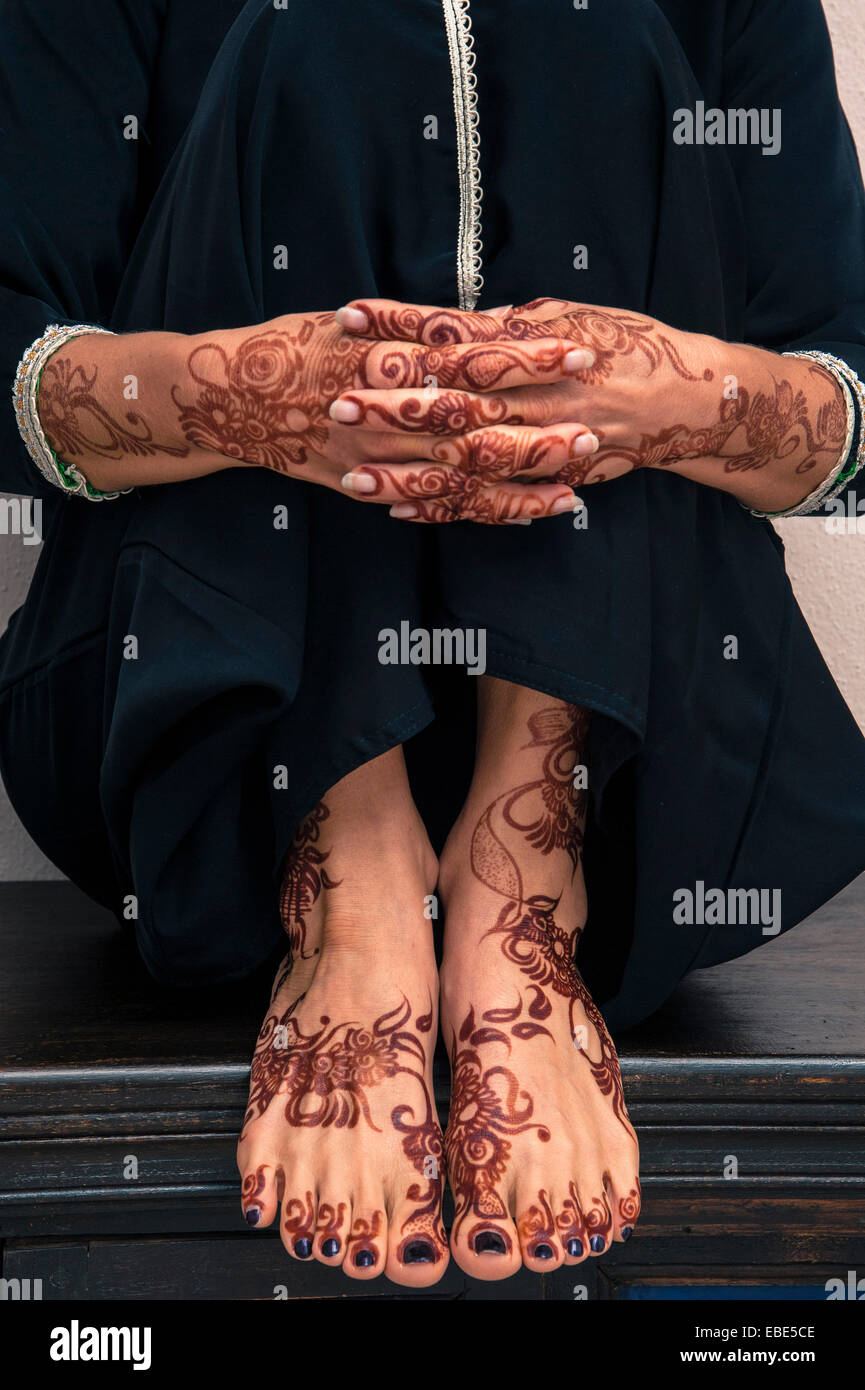 Close-up of Woman's Hands and Feet with Henna in Arabic Style Stock Photo