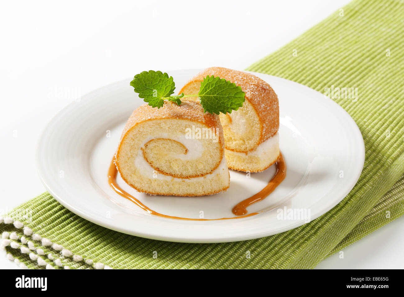Sponge cake roll with cream filling Stock Photo Alamy