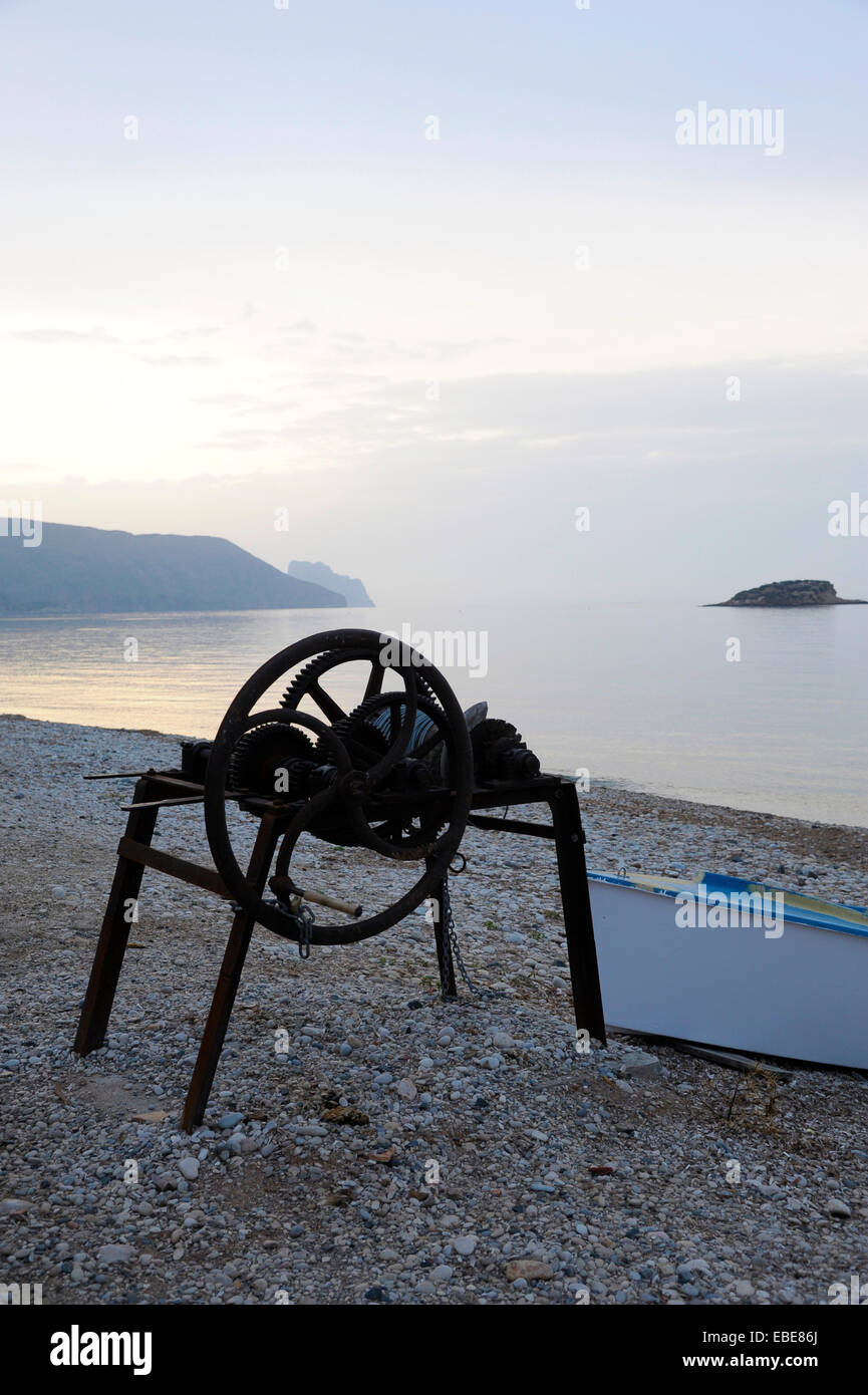 winch for pulling boats on the beach and boat on the beach of La Olla