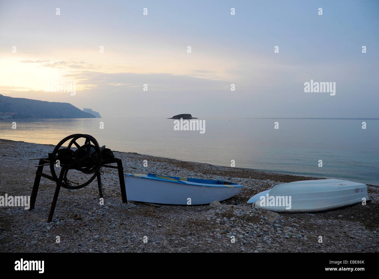 winch for pulling boats on the beach and boat on the beach of La Olla