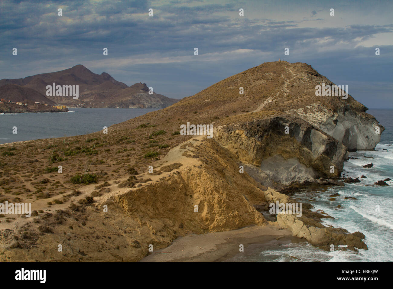 Cabo de Gata looking past Genoveses Beach towards San Jose village, showing the rock formations.   Cerro El Fraile in distance Stock Photo